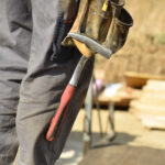 Image of a person wearing tools