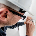 Image of a man doing electrical work.